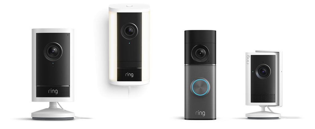 Ring indoor cameras and doorbell devices arranged on a white background