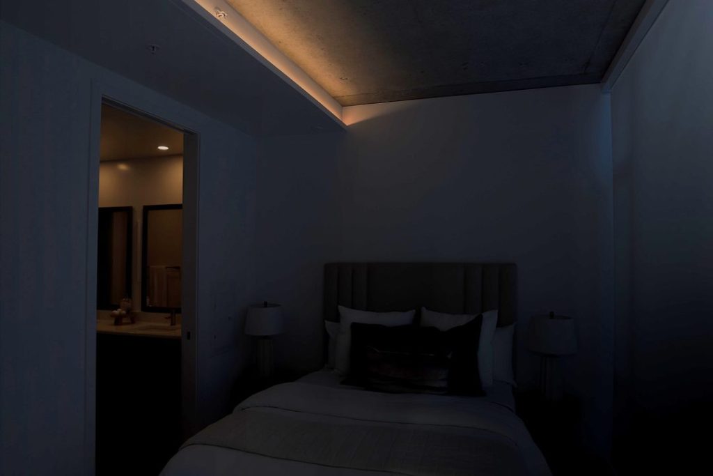 Bedroom in very low light nighttime mode with minimal ambient illumination