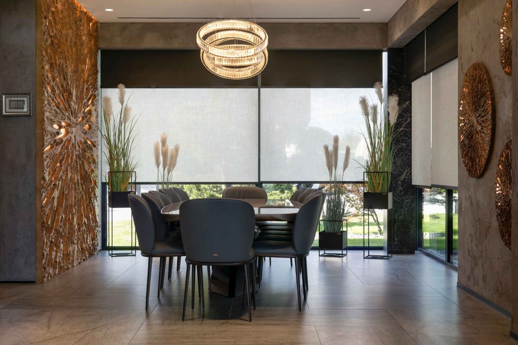Luxury dining room with motorized shades and integrated lighting control