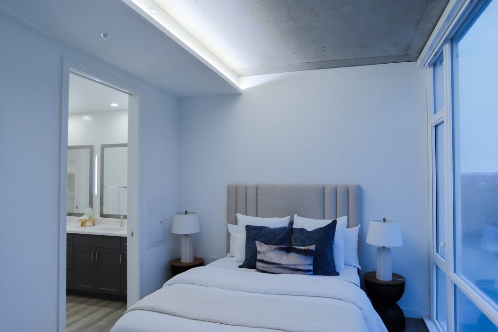 Bedroom lit with cool circadian lighting in early evening or daytime mode