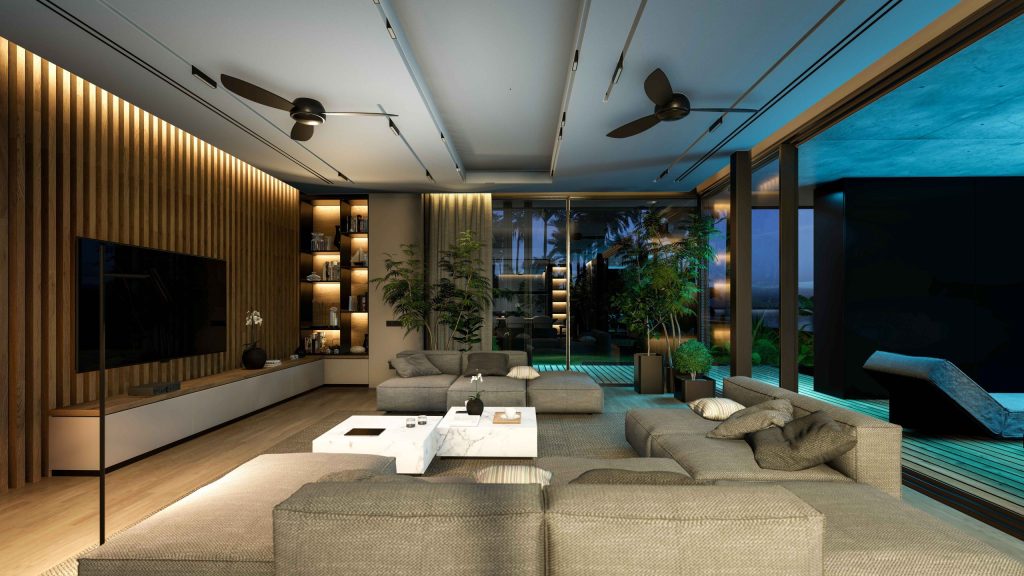 Modern living room at dusk with layered lighting, wood wall, and garden view
