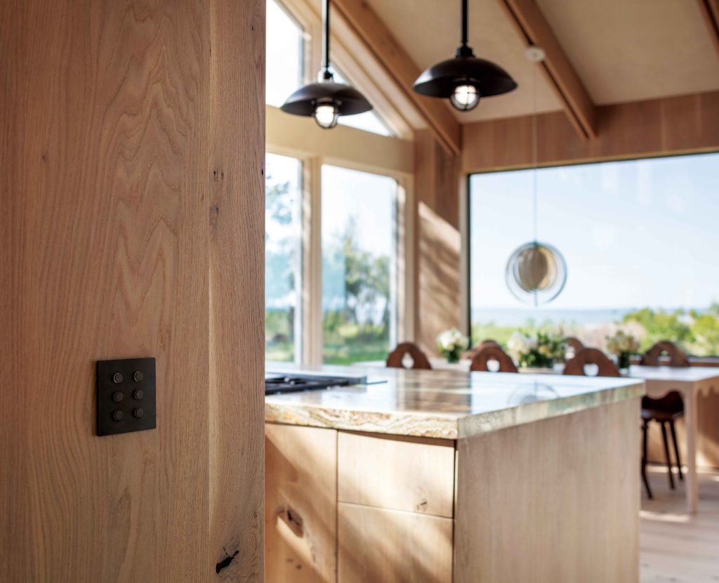 HomeWorks keypad integrated into a wood-paneled kitchen wall
