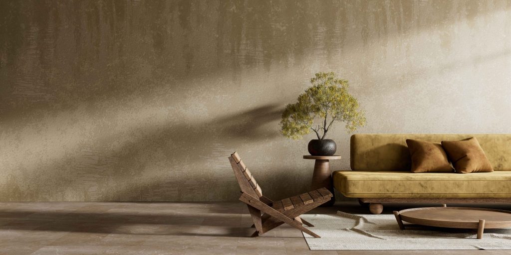 Minimalist living room with warm natural light and soft shadows on textured wall