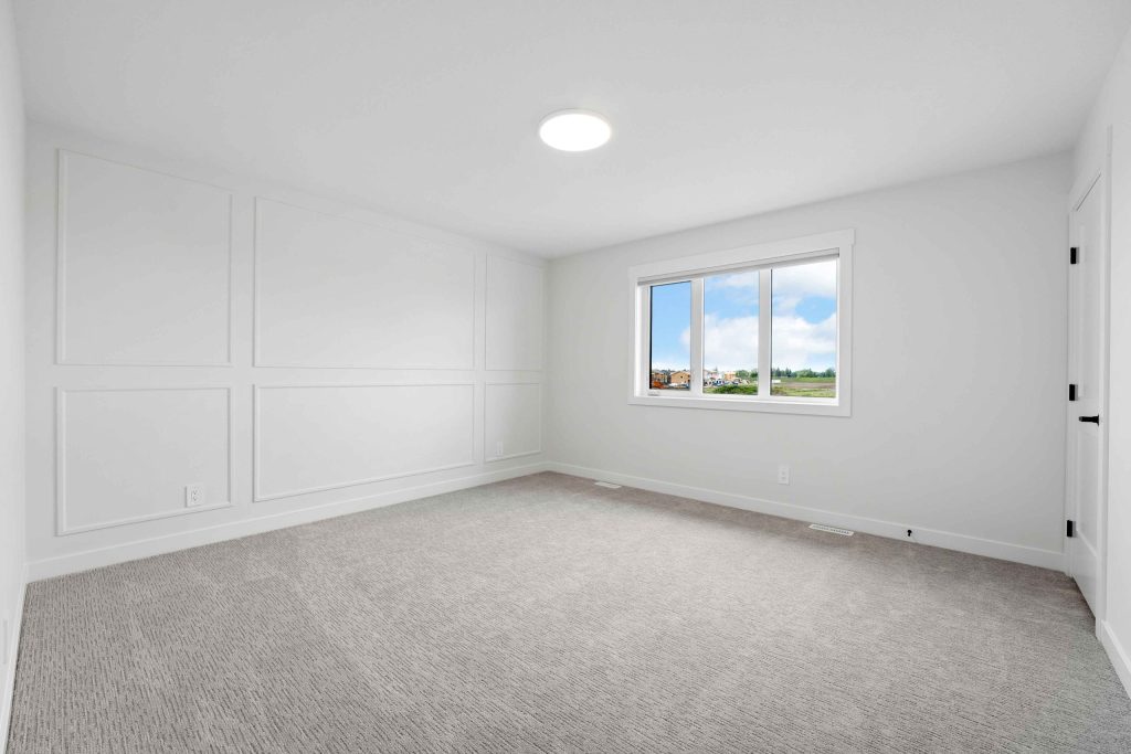 Minimal room uniformly lit by a central ceiling light