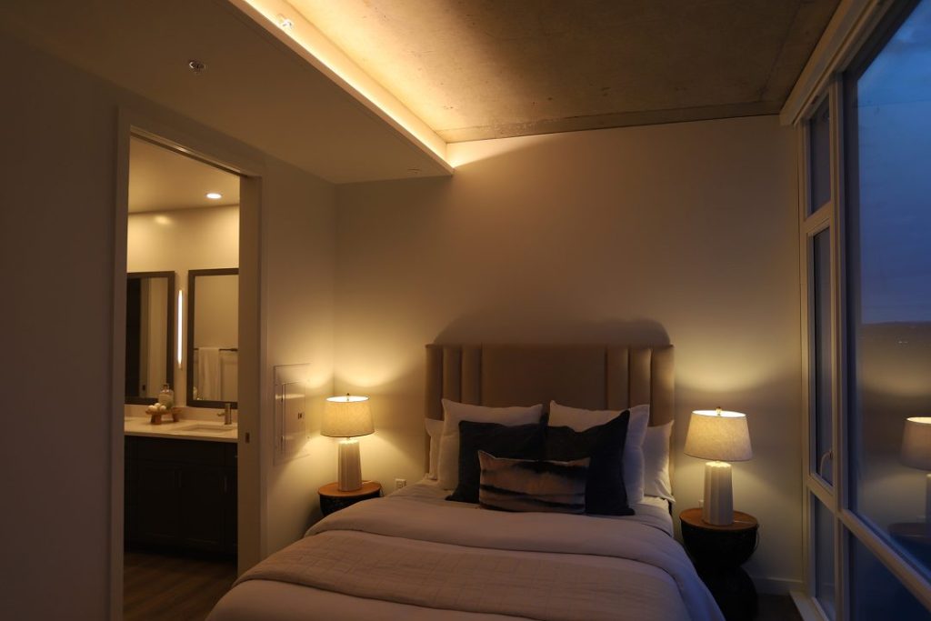 Bedroom lit with warm ambient circadian lighting in evening mode