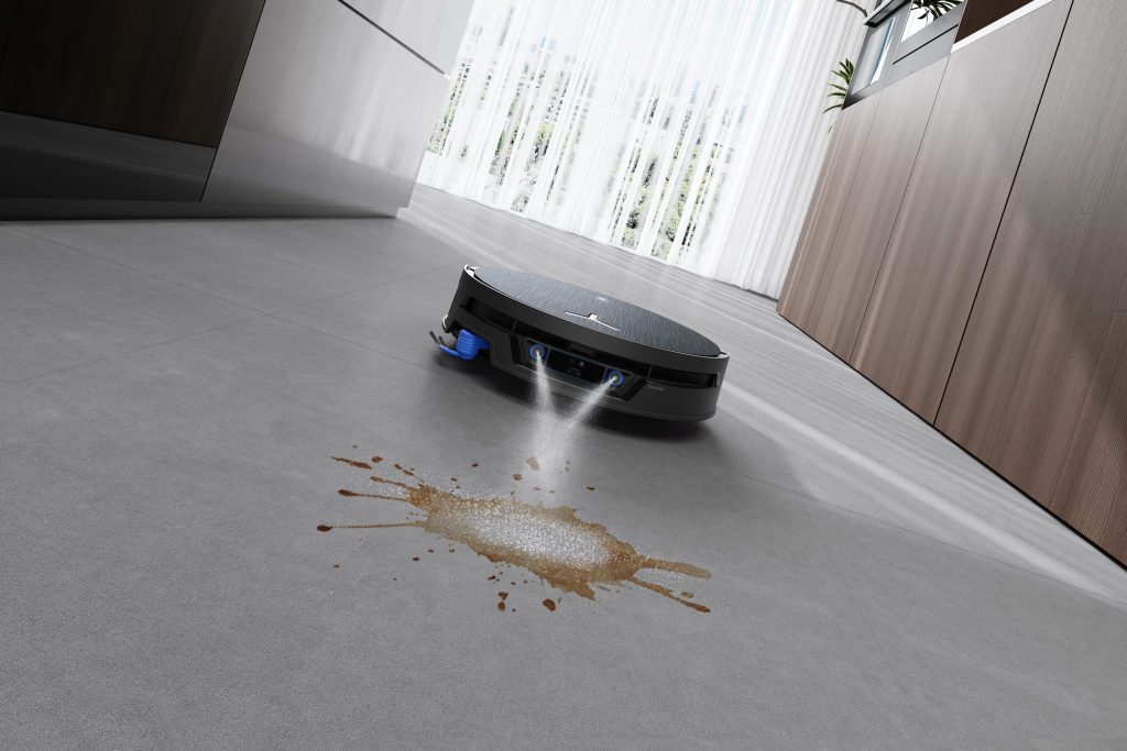 DEEBOT X12S PRO OMNIのFocusJet 2.0が床の汚れに洗浄液を噴射する様子