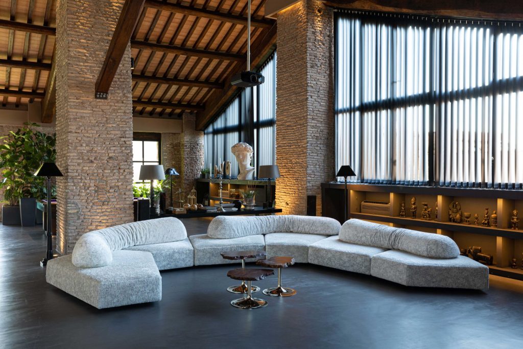 Edra On the Rocks modular sofa arranged in a luxurious art-filled interior