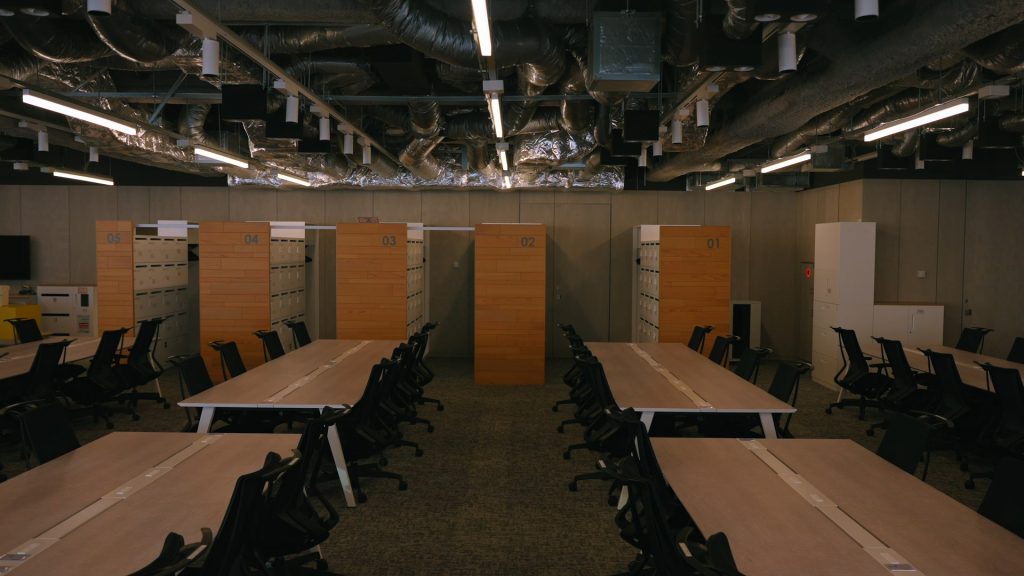 Open-plan office workspace with integrated ceiling lighting and air-conditioning equipment